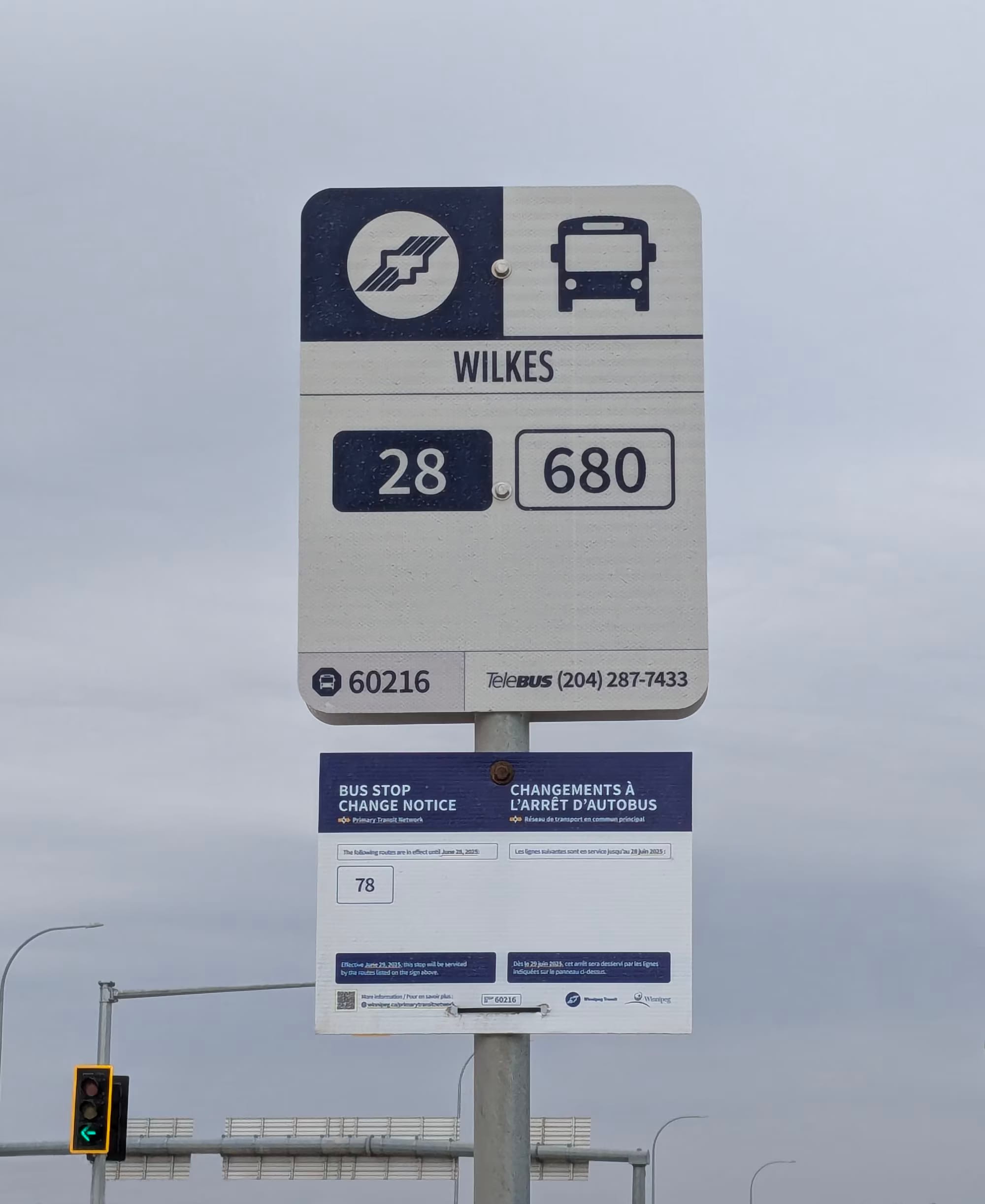 Bus stop sign with a bus stop change notice