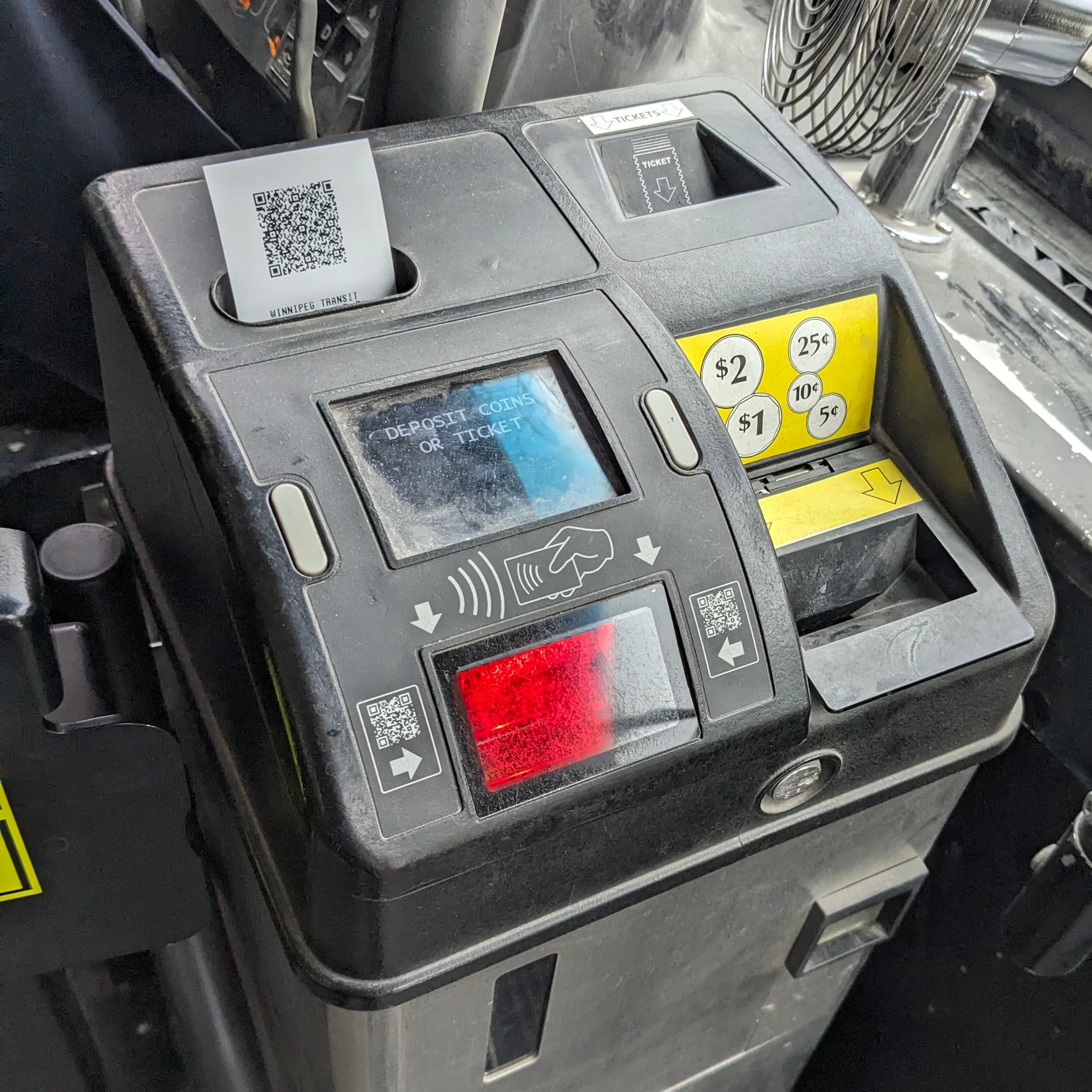 Fare box with a transfer sticking out, made of thermal paper